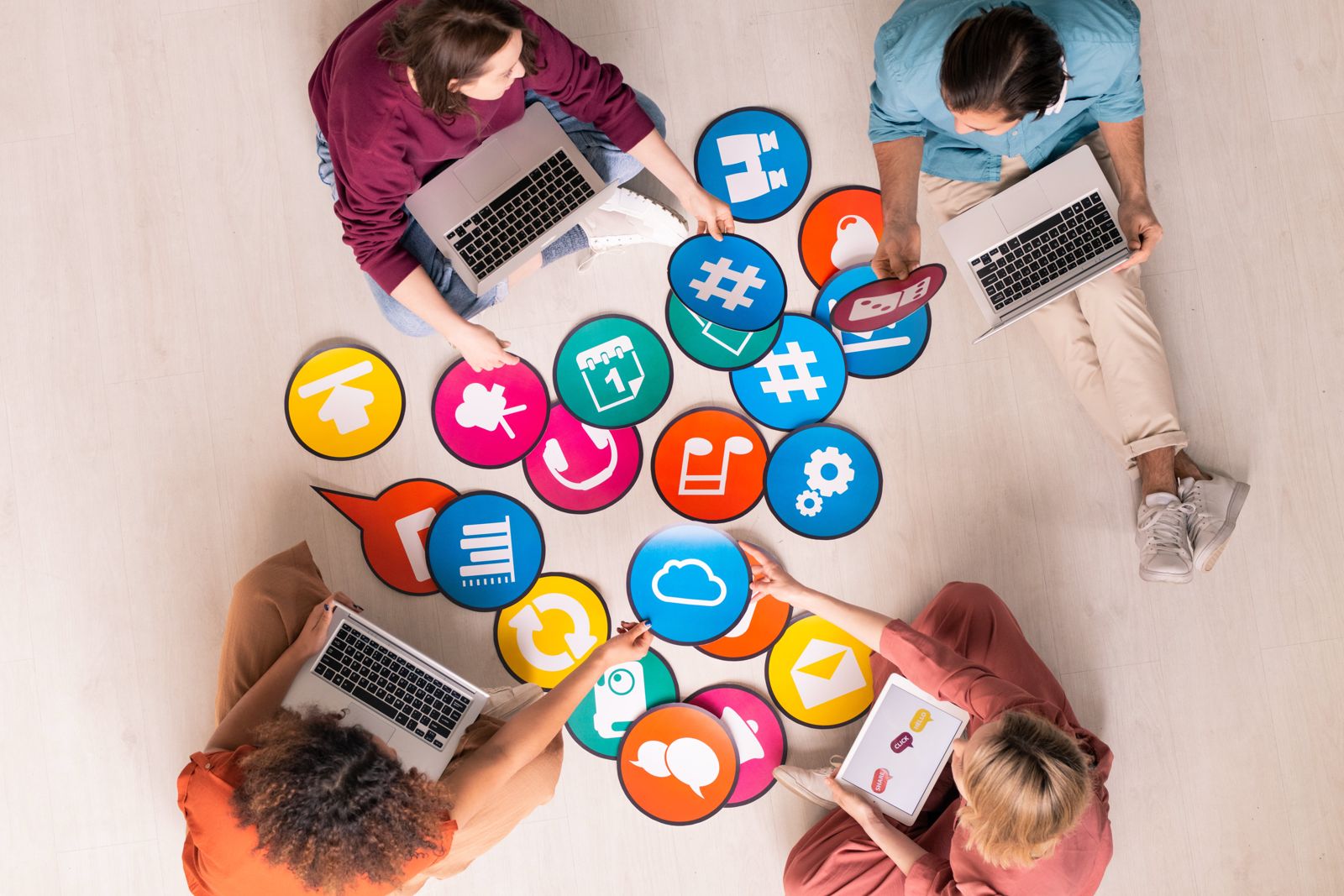 Marketing team planning a social media campaign with colourful social icons